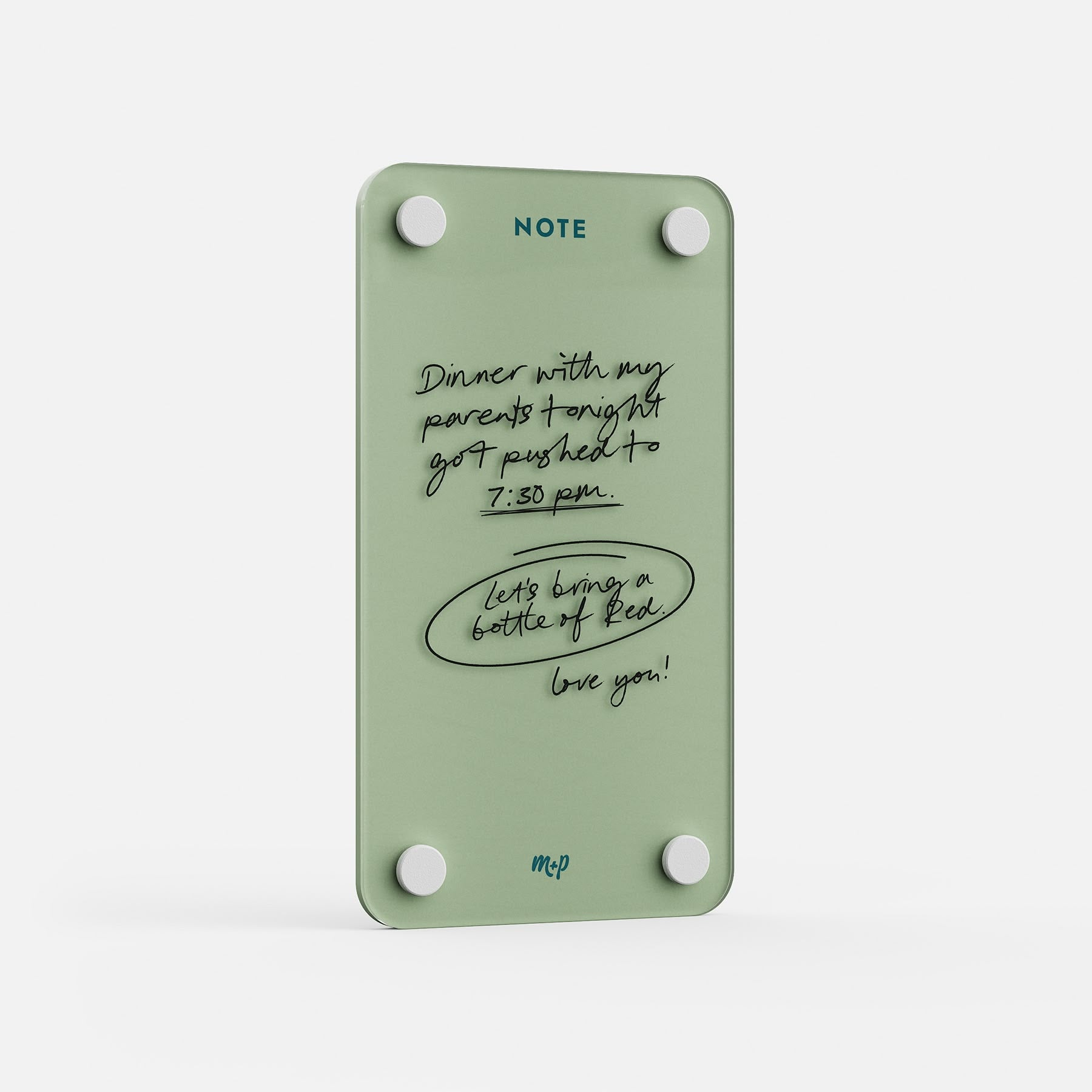 Angled view of a Matcha green tall magnetic acrylic note board with a handwritten note to a partner